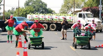 Three-person teams battle it out during Watermelon Bathtub Races during Hermiston Melon Fest.