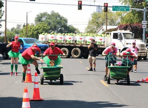Three-person teams battle it out during Watermelon Bathtub Races during Hermiston Melon Fest.