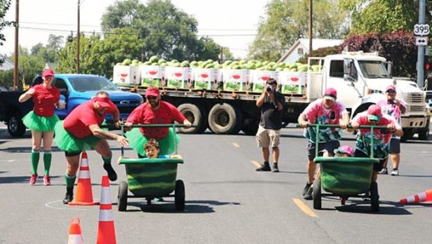 Three-person teams battle it out during Watermelon Bathtub Races during Hermiston Melon Fest.